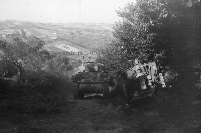 2nd Polish Corps in the Battle of Ancona - preparations for the conquest of the town. An M4 Sherman tank passess an  abandoned German gun.